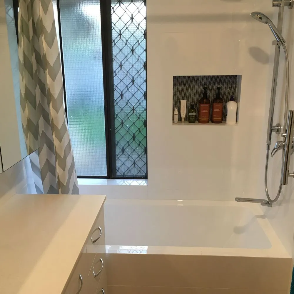 Modern bathroom with bathtub, shower and window