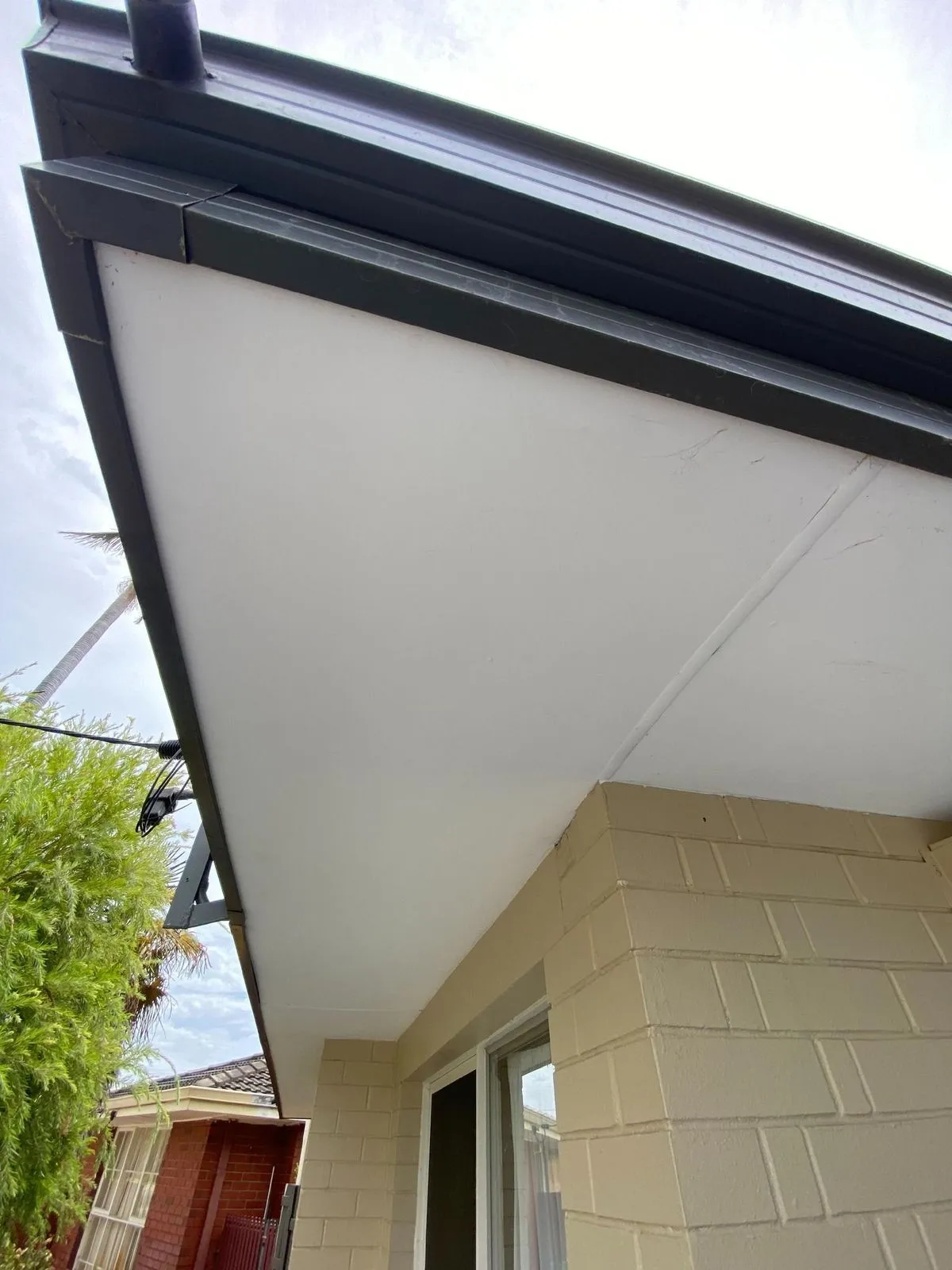 Modern charcoal guttering and white eave replacement on a Perth home